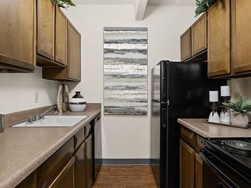 Albuquerque apartment for rent - a kitchen with a sink and a refrigerator