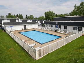 Chillicothe apartment for rent - an aerial view of a resort style pool in front of a white fence