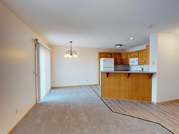 Rochester townhouse for rent - A kitchen area with a counter and cabinets.