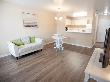 Grand Rapids apartment for rent - A living room with a white couch and a white chair.