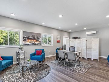 Overland Park apartment for rent - a living room and dining room with a table and chairs