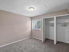 Overland Park apartment for rent - an empty bedroom with a closet and a window