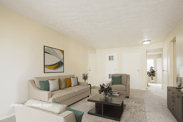Omaha apartment for rent - A living room with a couch, coffee table, and a painting on the wall.
