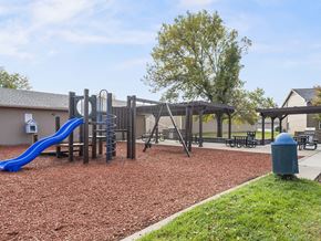 Cedar Rapids townhouse for rent - our playground is equipped with a swing set and slide
