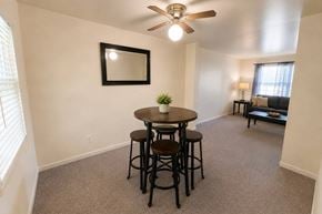 Rantoul townhouse for rent - A small dining room with a round table and four chairs.
