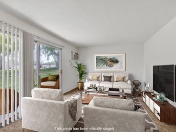 Rochester apartment for rent - a living room with a couch and a tv