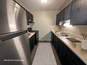 Toledo apartment for rent - Apartment kitchen with cabinets and a stainless steel refrigerator