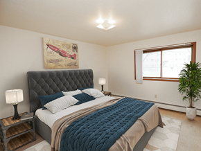 South Sioux City apartment for rent - a bedroom with a large bed and a window