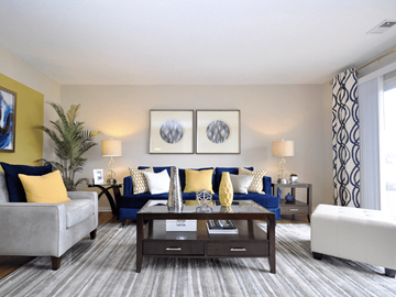 Grand Rapids apartment for rent - a living room with couches and a coffee table