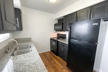 Granite countertops and black appliances