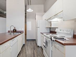 Toledo apartment for rent - apartment kitchen with white appliances and wooden counter tops and white cabinets