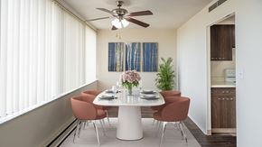 Lansing apartment for rent - A dining room with a white table and chairs.