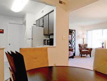 Beavercreek apartment for rent - a living room with a kitchen and a dining table