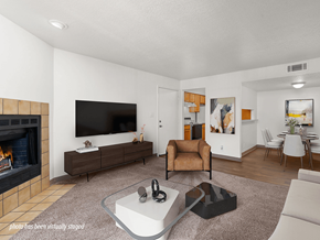 Albuquerque apartment for rent - A living room with a fireplace and a flat screen TV.