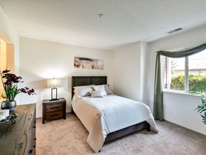 Waukegan apartment for rent - apartment bedroom with a bed and a window