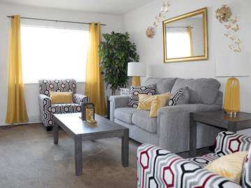 St. Louis apartment for rent - a living room with a couch and a coffee table