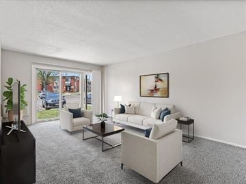 Cedar Rapids apartment for rent - the living room of an apartment with a couch and chairs