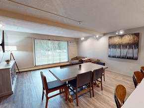 St. Cloud apartment for rent - A dining room with a long table and chairs.
