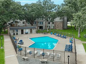 St. Cloud apartment for rent - A pool surrounded by a fence and chairs.
