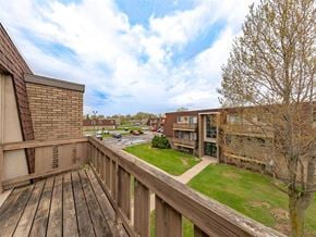 Sandusky apartment for rent - A balcony with a wooden floor and a wooden fence.