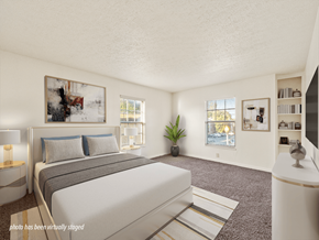 Clarksville townhouse for rent - A bedroom with a large bed and a painting on the wall.