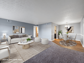 Clarksville townhouse for rent - A living room with a grey couch, a white coffee table, and a grey rug.