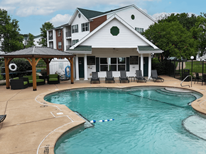 Valley Park apartment for rent - A pool in front of a white building with a gazebo.