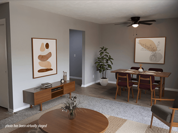 Omaha apartment for rent - A living room with a brown coffee table and a grey rug.