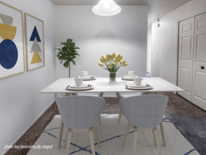 Keego Harbor apartment for rent - A dining room with a white table and chairs.