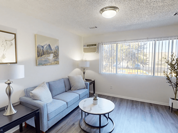 Greeley apartment for rent - a living room with a couch and a table