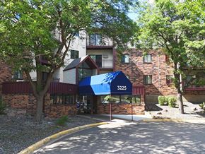 Saint Cloud apartment for rent - A building with a blue awning and the number 3225 on it.