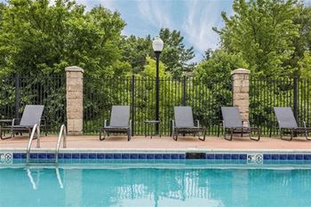 Sparkling swimming pool with sundeck