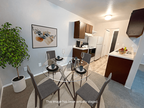 Davison apartment for rent - a kitchen and dining room with a glass table and chairs
