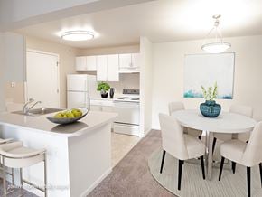 Kentwood apartment for rent - A kitchen with a table and chairs.