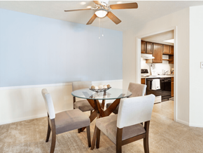 Mishawaka townhouse for rent - A dining room with a glass table and chairs.