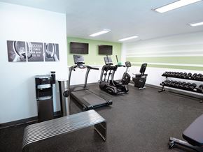 Grand Rapids townhouse for rent - A gym with treadmills, weights and exercise equipment.