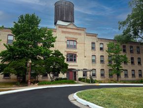 Grand Ledge townhouse for rent - a large brick building with a silo on top