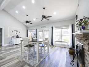 Kettering apartment for rent - a dining room with a table and chairs in front of a fireplace