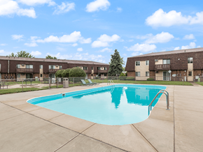 Sandusky apartment for rent - a swimming pool in front of an apartment building