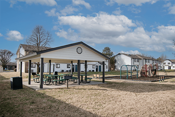 Covered bbq patio with seating & grill