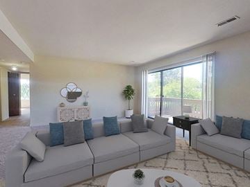 Flint apartment for rent - a living room with a couch and a table