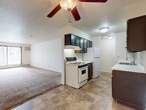 Burnsville apartment for rent - A kitchen with a white oven and a brown counter.