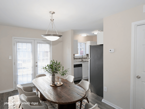 Greenville apartment for rent - A dining room with a wooden table and chairs.