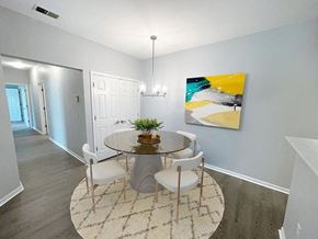 Norton Shores apartment for rent - dining area with overhead lighting