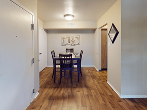 St. Louis apartment for rent - A dining room with a wooden table and chairs.