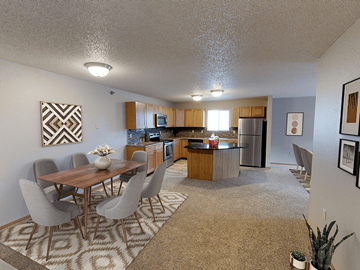 Minot apartment for rent - A kitchen with a dining table and chairs.