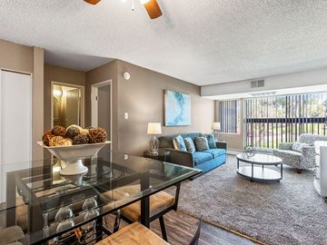 Albuquerque apartment for rent - A living room with a glass table and a sofa.