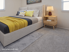Brooklyn Center apartment for rent - A bedroom with a bed, nightstand, and lamp.