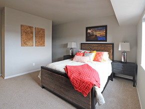 Minot apartment for rent - a bedroom with a bed and two nightstands