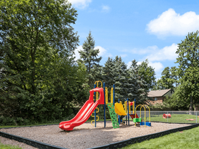 Maumee apartment for rent - a playground with a slide at an apartment community